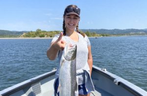 Holding a fish on a sunny day